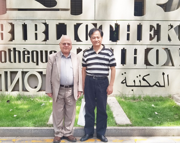 納比勒·蘇萊曼(左)與薛慶國